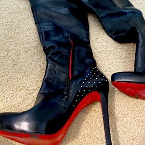 Red soled thigh high stiletto boots